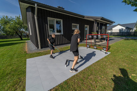 Young players training floorball outdoors