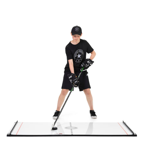 Young hockey player stickhandling on a Better Hockey Game Changer training station