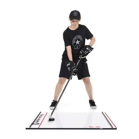 Young hockey player training on the Game Changer LITE stickhandling board in hockey gear