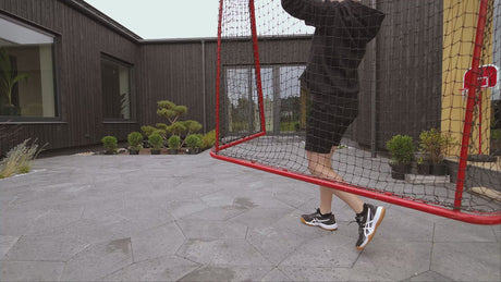 Floorball goal with a safety net in the yard
